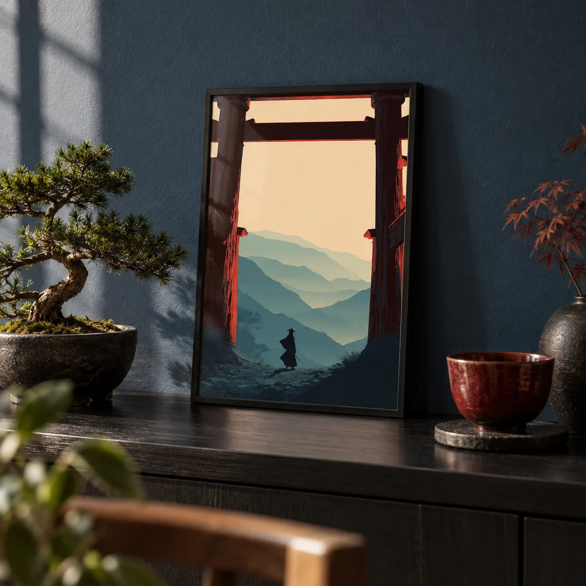 Samurai Mountain Poster, a small A4 framed print leaning on a black shelf in a living room