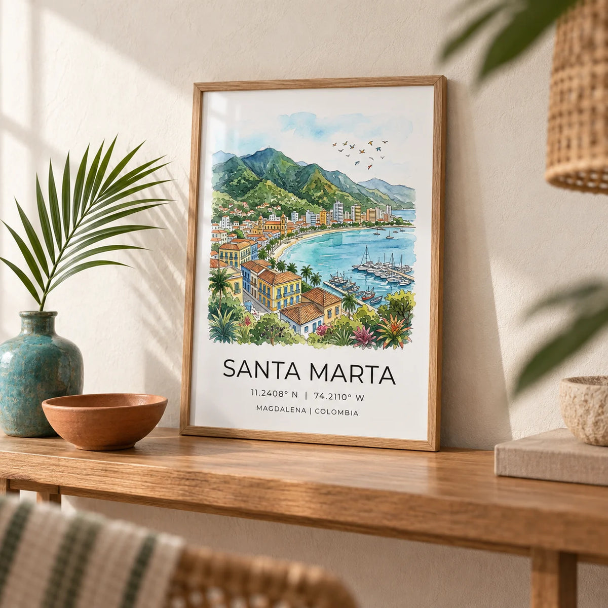 Santa Marta Art Print, a small A4 framed print leaning on a narrow oak side table in a hallway