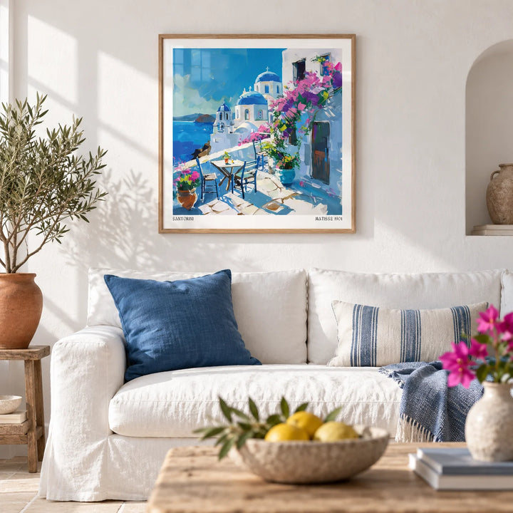Santorini Wall Art Prints, framed on the wall of a bright Greek-island style living room with smooth white limewashed walls and a plain pale stone floor