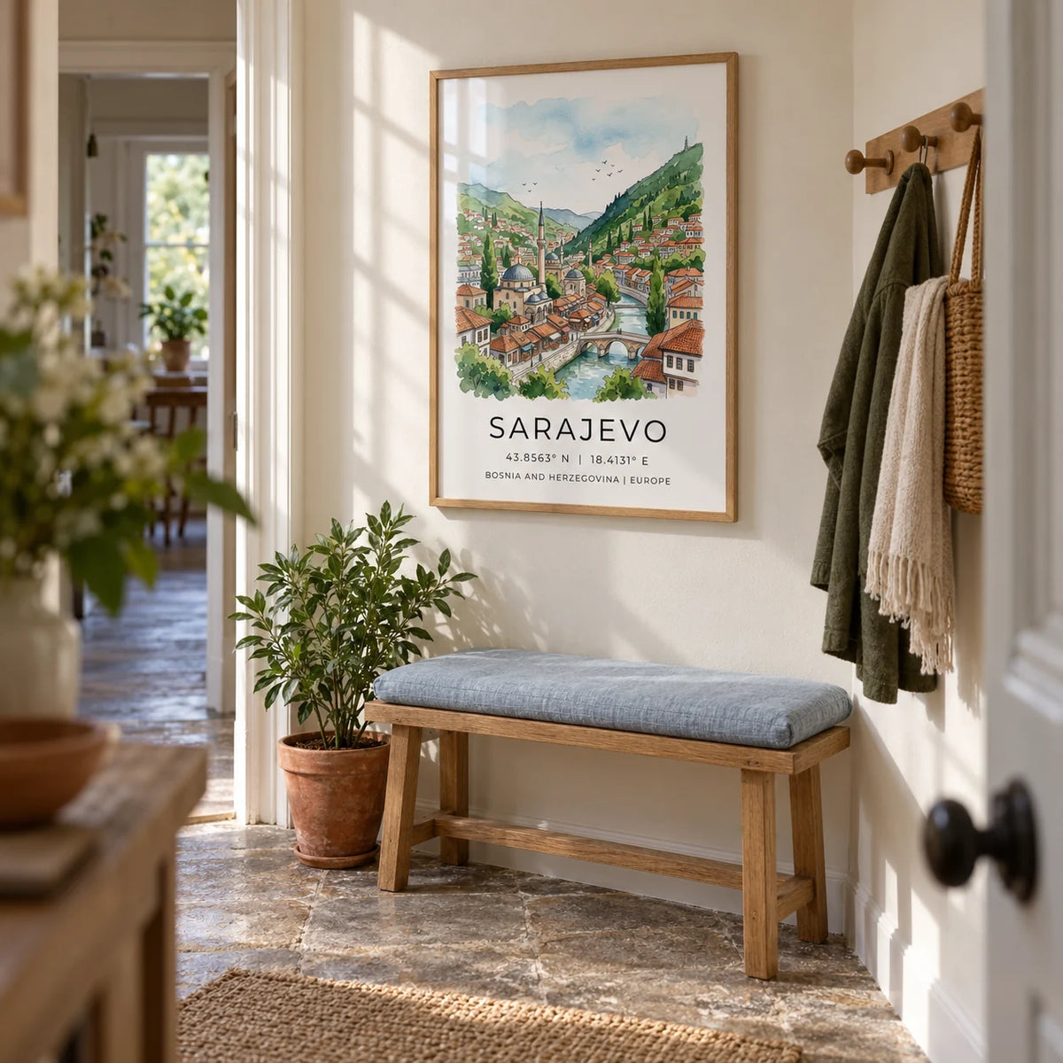 Sarajevo City Print, framed on the wall of a bright narrow hallway in a UK terraced home with cream walls and worn stone floor tiles