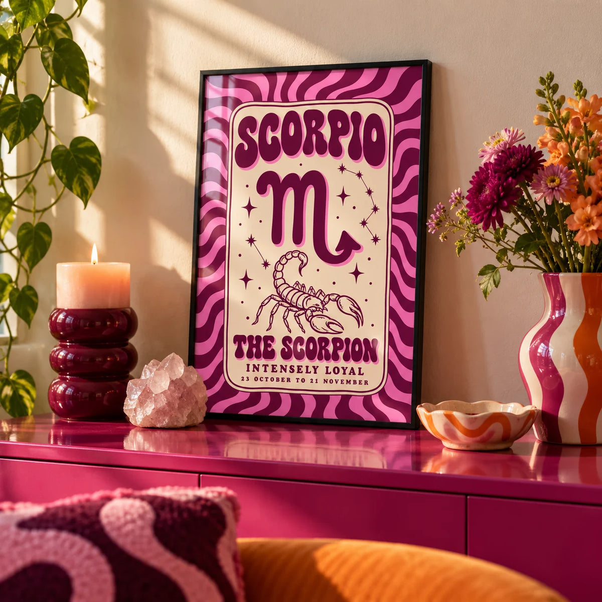 Scorpio Print, a small A4 framed print leaning on a colourful lacquered shelf in a living room