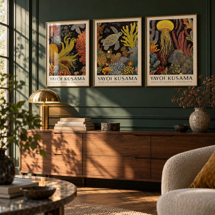 Sea Life Prints Set of 3 styled above a walnut sideboard against a deep green panelled wall: Golden Tentacle, Turtle Drift and Luminous Drift shown framed side by side (frames not included)