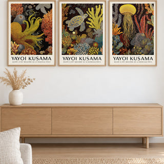 Sea Life Prints Set of 3 hung at eye level above a light oak sideboard: Golden Tentacle, Turtle Drift and Luminous Drift shown framed side by side (frames not included)