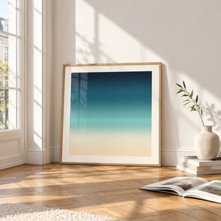 Sea Print, framed and leaning on the parquet floor of a bright living room