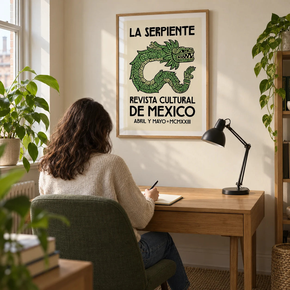 Serpent Cultural Art Print, framed on the wall of a creative home study in a UK first flat for an adult aged 25-35 with an ivory wall and a plain green desk chair