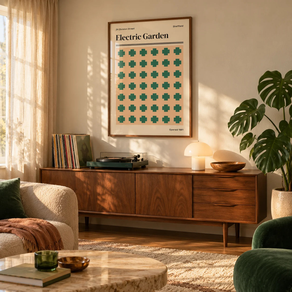 Sheffield Print, framed on the wall of a warm living room with soft golden light through a sheer curtain
