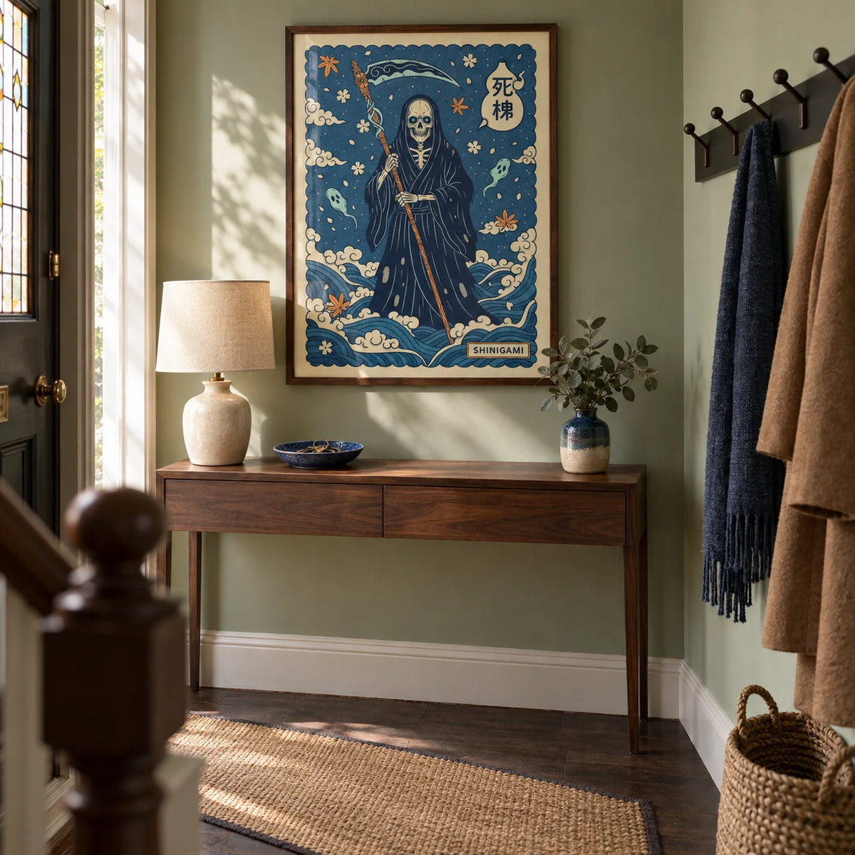 Shinigami Art, framed on the wall of a characterful entrance hallway in a renovated UK terrace with pale green walls and dark wood flooring