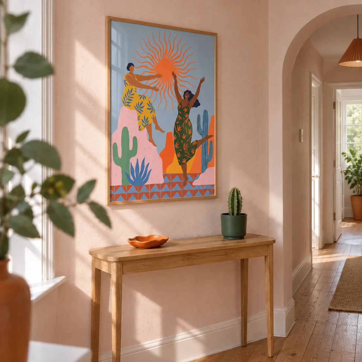 Sunset Women Art Print, framed on the wall of a bright narrow hallway in a renovated UK terrace with pale pink plaster walls and natural oak floorboards