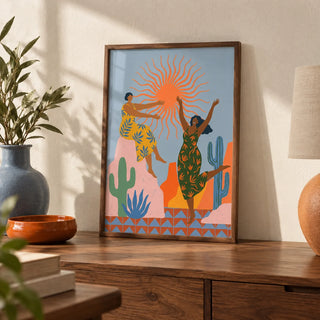 Sunset Women Art Print, a small A4 framed print leaning on a walnut side table in a hallway
