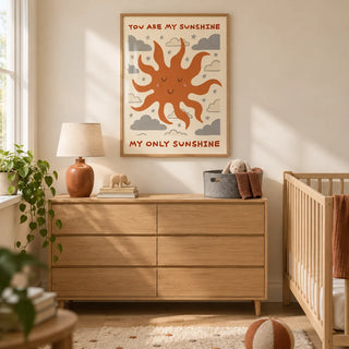 Sunshine Quote Wall Art, framed on the wall of a warm modern nursery in a UK terraced family home with cream walls and pale oak floorboards