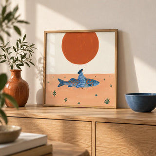 Surreal Fish Art Print, a small A4 framed print leaning on a pale oak sideboard in a living room