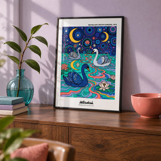 Swan Art Print, a small A4 framed print leaning on a walnut sideboard in a living room