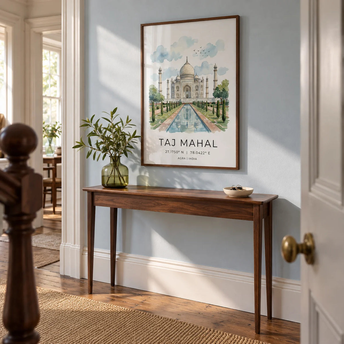Taj Mahal Art Print, framed on the wall of a welcoming hallway in a Victorian terrace with a chalky pale blue wall and original timber floorboards
