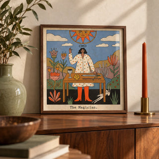 Tarot Magician Wall Art, a small A4 framed print leaning on a walnut sideboard in a living room