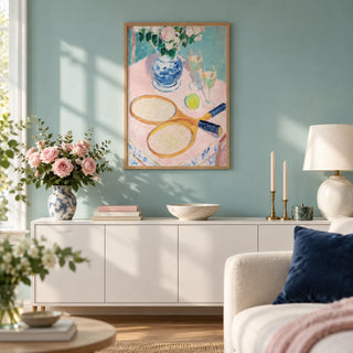 Tennis Still Life Print, framed on the wall of a bright living room with a pale teal wall