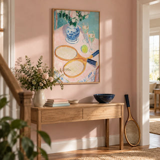 Tennis Still Life Print, framed on the wall of a hallway with a pale pink wall