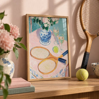 Tennis Still Life Print, a small A4 framed print leaning on an oak shelf in a living room