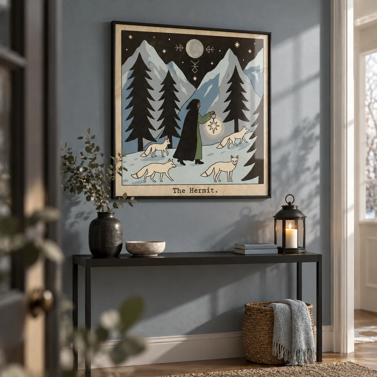 The Hermit Tarot Card Art, framed on the wall of a calm hallway with an icy blue-grey wall