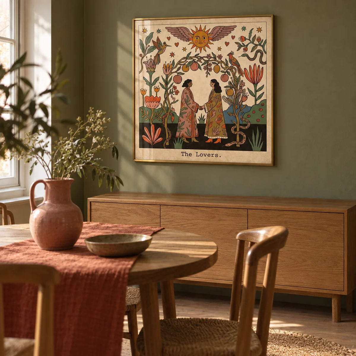 The Lovers Tarot Card Art, framed on the wall of a characterful dining nook in a UK flat with muted olive walls and a plain wooden floor