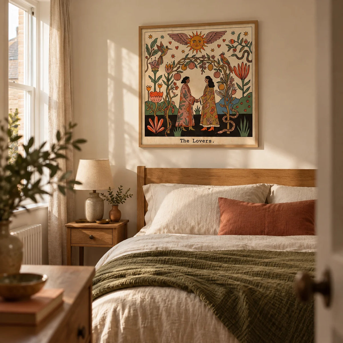 The Lovers Tarot Card Art, framed on the wall of a softly eclectic adult bedroom in a UK terrace with warm cream walls