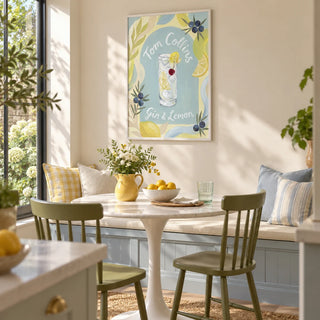 Tom Collins Art Print, framed on the wall of a sunny breakfast nook in a UK kitchen extension with a cream wall