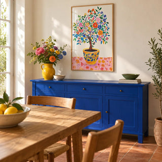 Tree of Life Wall Art, framed on the wall of a sunny dining room with warm white plaster walls and a terracotta floor