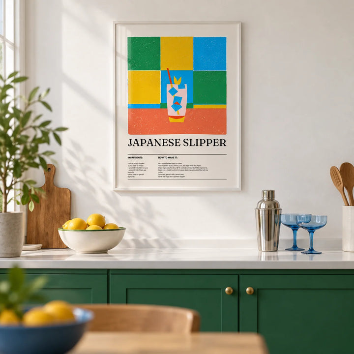 Trendy Wall Art, framed on the wall of a bright kitchen with plain green painted cabinets and a white worktop