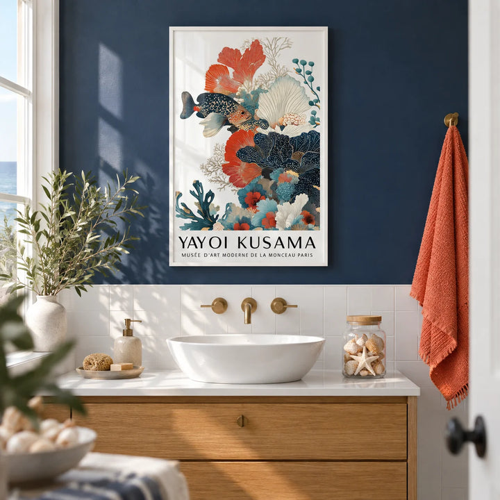 Tropical Fish Poster, framed on the wall of a bright coastal bathroom with a navy painted wall and plain white tiles below