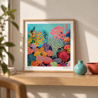 Tropical Sea Wall Art, a small A4 framed print leaning on a pale oak shelf in a living room