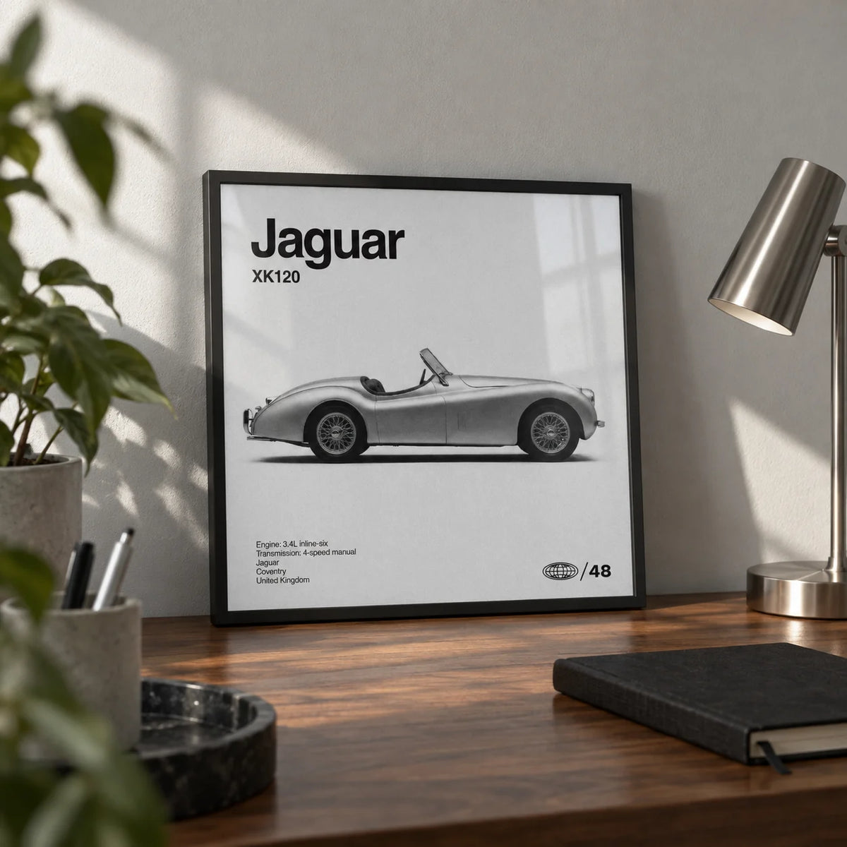 Vintage 1950s Roadster Poster, a small A4 framed print leaning on a walnut desk