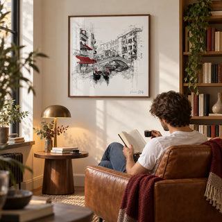 Wall Art of Venice Italy, framed on the wall of a cosy study with a warm white wall and book shelves