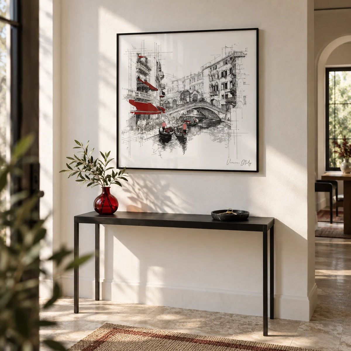 Wall Art of Venice Italy, framed on the wall of an elegant hallway with a white wall and a stone floor