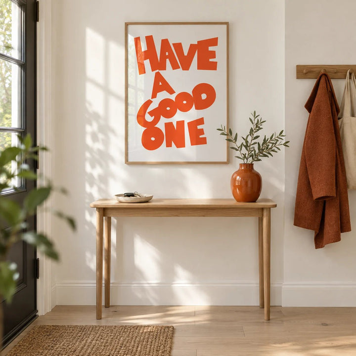 Wall Art Typography, framed on the wall of a bright hallway right by the front door with a white wall and a pale oak floor