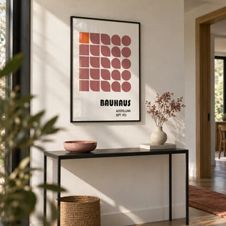 Wall Hanging Geometric, framed on the wall of a modern hallway with a white wall