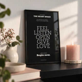 Wall Quotes for Bedroom, a small A4 framed print leaning on a black shelf in a living room