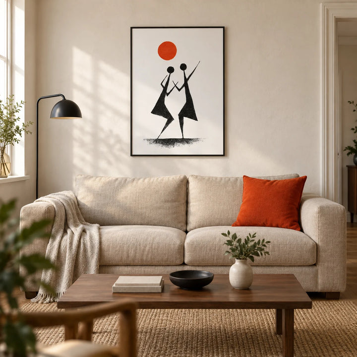 Warli Folk Art Print, framed on the wall of a warm modern living room in a UK terraced house with an off-white plaster wall and oak floor