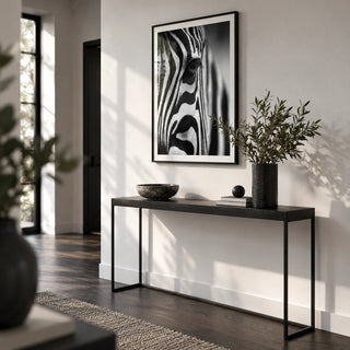 Wildlife Photography Poster, framed on the wall of a monochrome hallway with a white wall and a dark wood floor