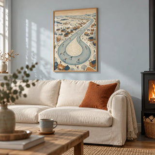 Winter Village Scene, framed on the wall of a cosy living room with an icy pale blue painted wall and a black wood burner