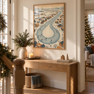 Winter Village Scene, framed on the wall of a hallway at Christmas with a warm white wall